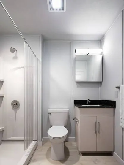 Private ensuite bathroom with vanity and shower