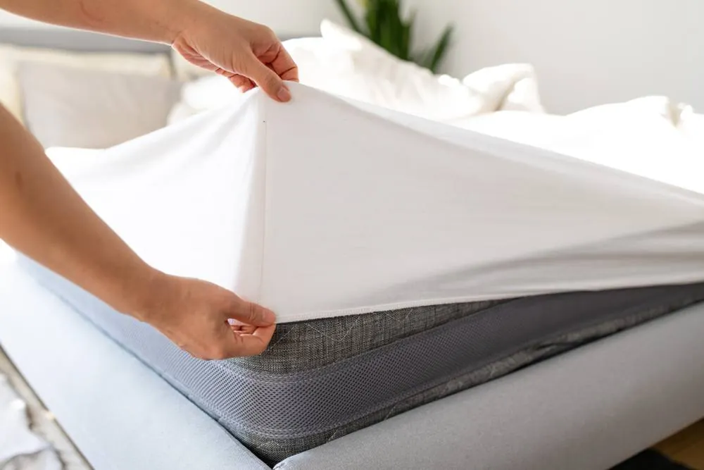 Mattress protector being fitted