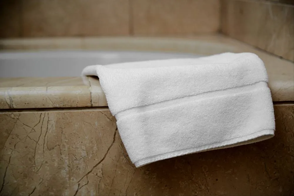 Bath mat on tub edge